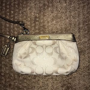 Gold metallic coach wristlet
